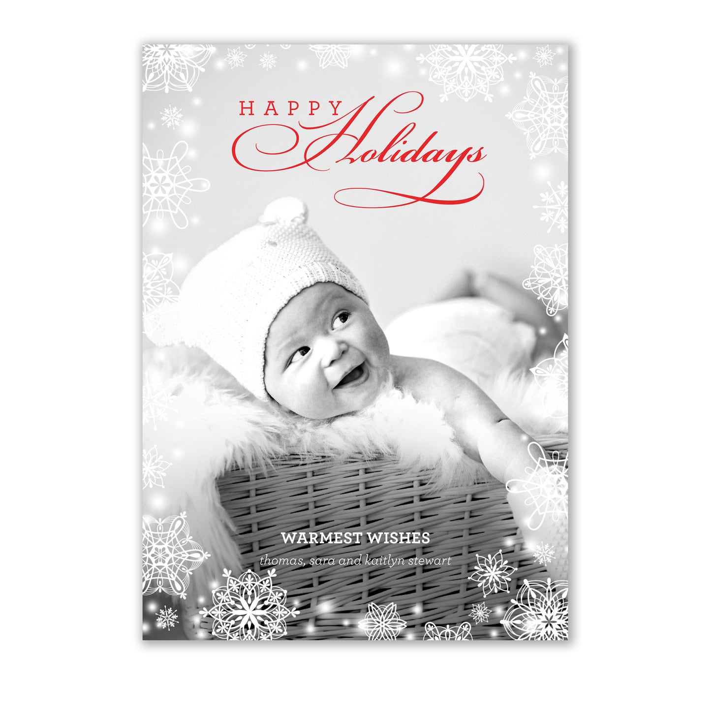A Noteworthy Sparkling Snowflakes Photo Card featuring a baby in a basket surrounded by snowflakes.