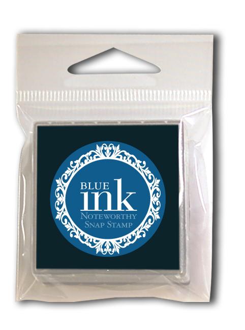 A Noteworthy Blue Snap Stamper Ink Pad Refill, sealed in plastic and compatible with blue ink snap stamps, features a decorative circular front design.