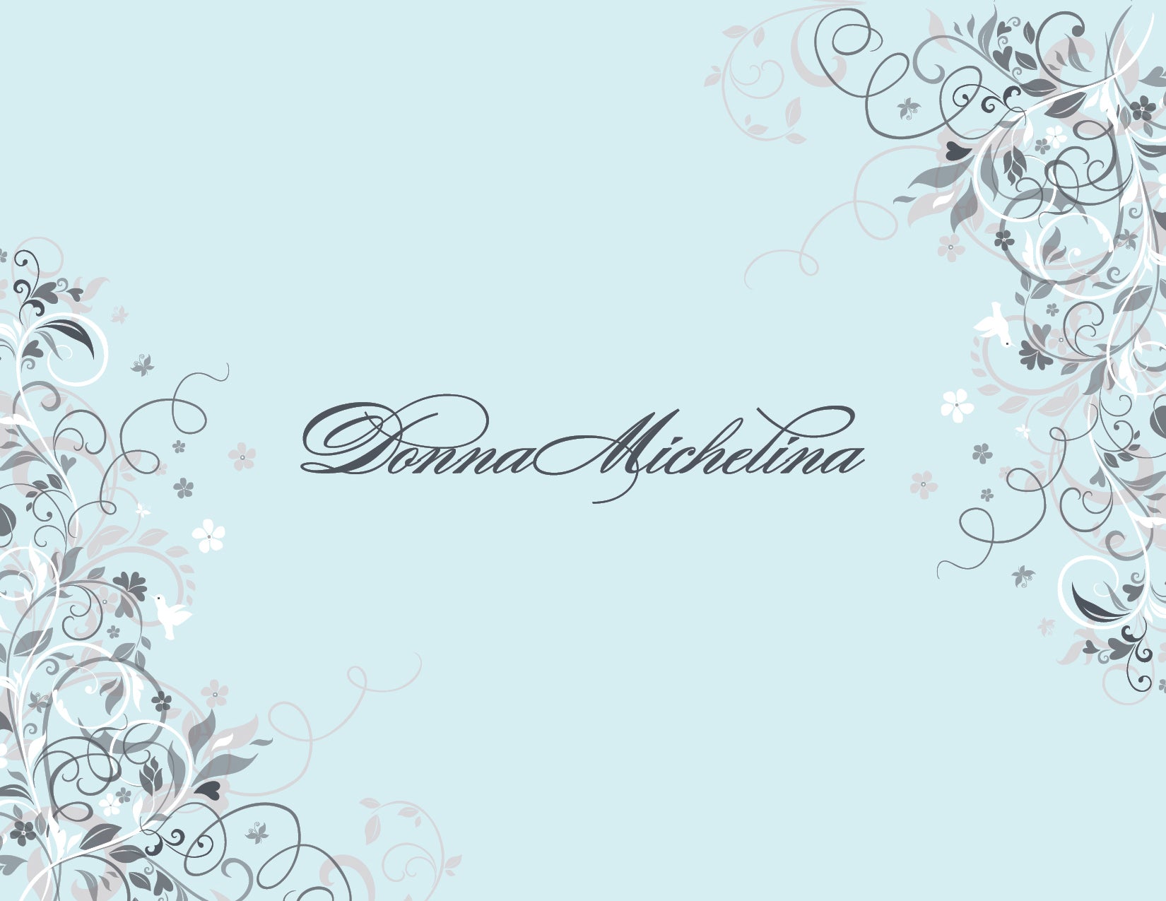 Floral Corners Blue Thank You Cards by Noteworthy feature a light blue background with ornate gray and white floral vine corners and "Donna Michelina" in elegant script—ideal for white thank you notes or matching envelopes.