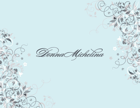 Floral Corners Blue Thank You Cards by Noteworthy feature a light blue background with ornate gray and white floral vine corners and "Donna Michelina" in elegant script—ideal for white thank you notes or matching envelopes.