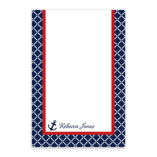 The Noteworthy Nautical Personalized Notepad features a navy and white pattern, red border, anchor icon, and "Rebecca Jones" printed at the bottom right.