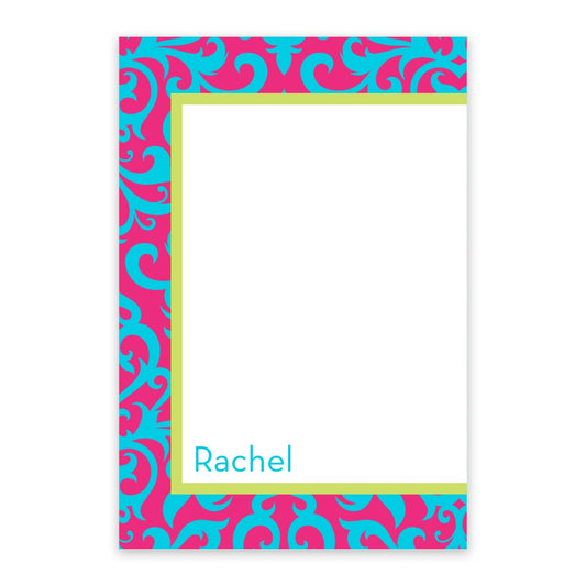 The Noteworthy Colorful Damask Personalized Notepad features 100 rectangular turquoise sheets with a pink and blue damask border, a blank white center, and "Rachel" printed in blue at the bottom left.