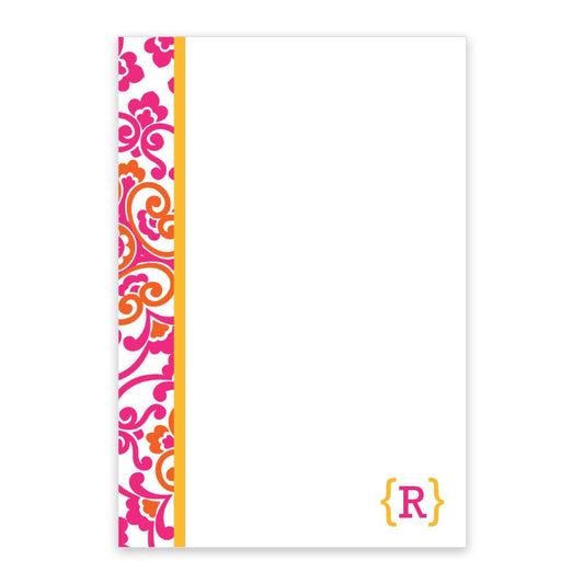 The Noteworthy Bohemian Personalized Notepad features 50 white sheets with a pink flower design, orange accents on the left edge, and a yellow bracket with an "R" in the bottom right corner.