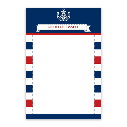 The Noteworthy Nautical Stripes Personalized Notepad has a nautical emblem, red and blue stripes, “Michelle Connell” at the top, and a blank white space in the center for writing.