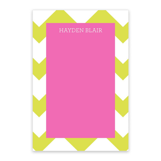 The Noteworthy Large Green Chevron Personalized Notepad features a green and white chevron border, a spacious center for notes, and customization with your name at the top in bold uppercase letters.