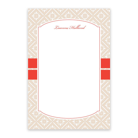 The Orange Banded Personalized Notepad by Noteworthy features a rectangular floral design with orange accents, a beige patterned border, and "Luanne Holland" in red script. With 100 sheets, it’s ideal for notes or lists.