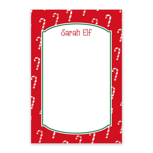 The Candy Cane Personalized Notepad by Noteworthy features a red candy cane border, a blank white center, and your custom name in red at the top—ideal for festive holiday notes!.
