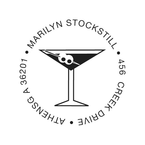 The Noteworthy Martini Stamper or Embosser showcases a martini glass with olives, encircled by “Marilyn Stockstill, 456 Creek Drive, Athens GA 36201.” Ideal for designer self-inking stamps or embossers.