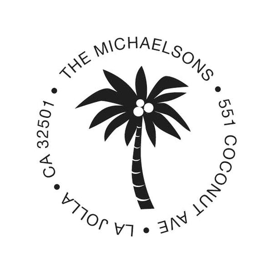 The Noteworthy Palm Tree Stamper or Embosser features a black and white circular palm tree design with “The Michaelsons, 551 Coconut Ave, La Jolla, CA 32501” around the edge—ideal for embossers or self-inking stamps.