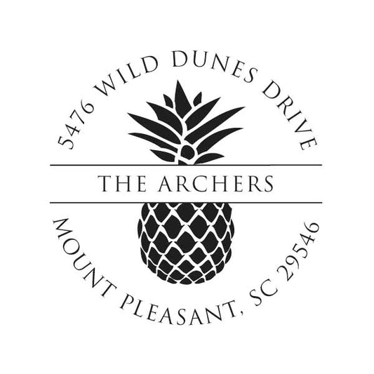 The Noteworthy Banded Pineapple Stamper or Embosser features a black and white circular design with a pineapple, "The Archers," and "5476 Wild Dunes Drive, Mount Pleasant, SC 29546"—ideal for custom return address stamps.