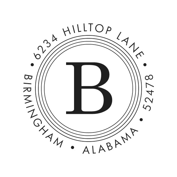 The Quad Circle Initial Stamper or Embosser by Noteworthy features a bold central "B" encircled by "6234 Hilltop Lane, Birmingham, Alabama 52478." Ideal for those seeking designer self-inking stamps with a personalized touch.