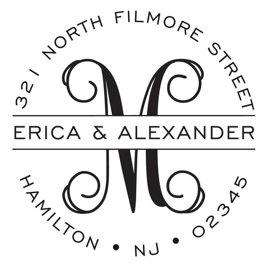 The Noteworthy Banded Script Initial Stamper or Embosser features a black and white circular monogram with "Erica & Alexander" over a decorative "M" and "321 North Filmore Street, Hamilton, NJ 02345" on the border—perfect for personalized use.