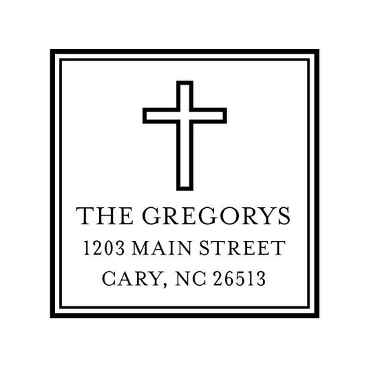 The Noteworthy Simple Cross Square Stamper or Embosser features a black cross above "The Gregorys, 1203 Main Street, Cary, NC 26513," framed by a square black border on white—ideal for custom stamping or embossing.