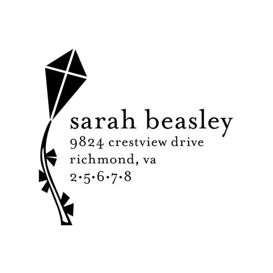 Noteworthy Kite Stamper or Embosser features a black kite illustration with a flying kite next to custom text—ideal for personalizing your mail or documents with a stylish touch.